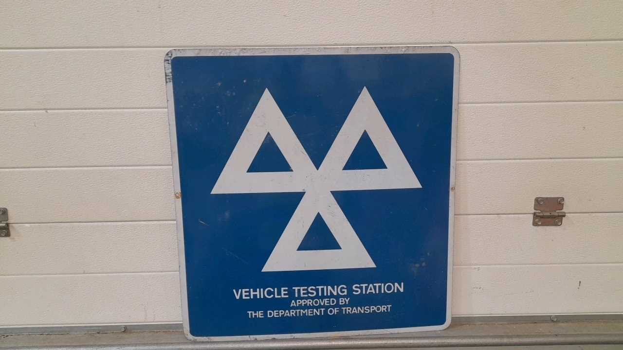 Lot 118 - VEHICLE TESTING STATION TIN SIGN  24" X 25"