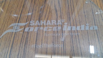 Lot 440 - FORCE INDIA FORMULA 1 TEAM RACE WHEEL COFFEE TABLE  ENGRAVED