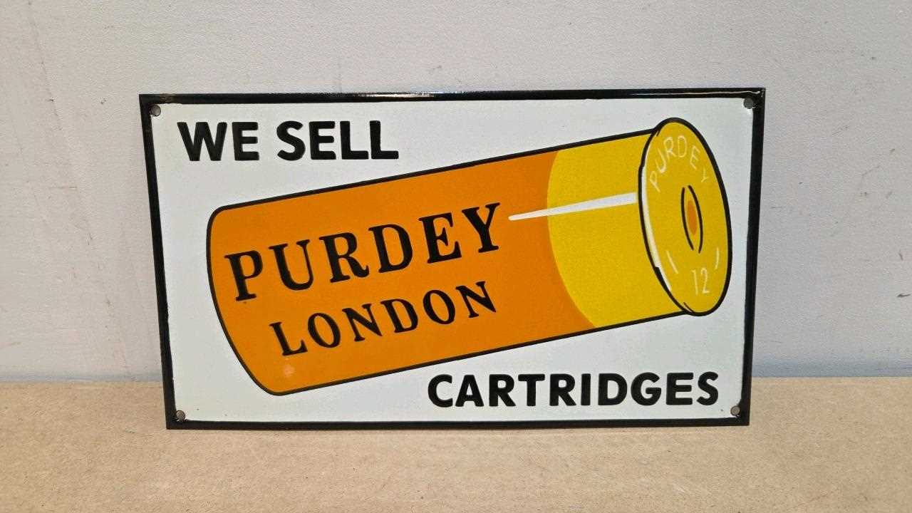 Lot 29 - WE SELL PURDEY CARTRIDGES REPRO ENAMEL SIGN 15" X 10"