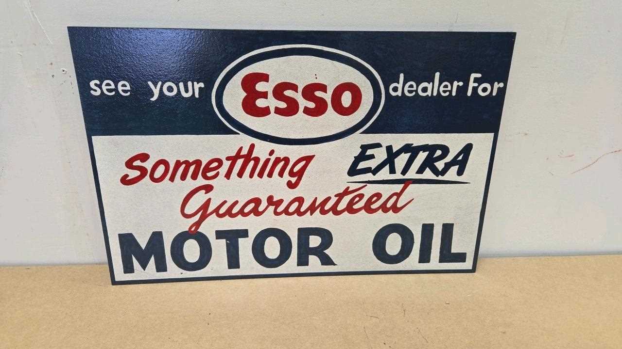 Lot 151 - WOODEN HAND PAINTED ESSO SOMETHING EXTRA SIGN 24" X 16"