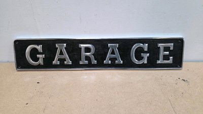 Lot 507 - CAST ALUMINIUM REPRO GARAGE SIGN 27" X 5"
